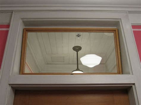 light fixture    front   mirror   door   room