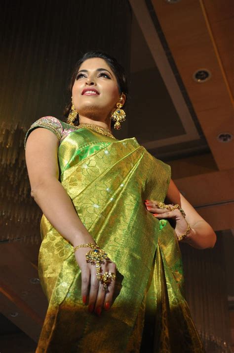parvathy omanakuttan stills in silk saree at palam silkine fashion show