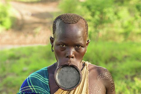 woman from the african tribe surma with big lip plate photograph by