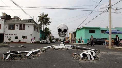 Day Of The Dead Giant Skeleton Crawls Out Of Mexico Street Bbc News