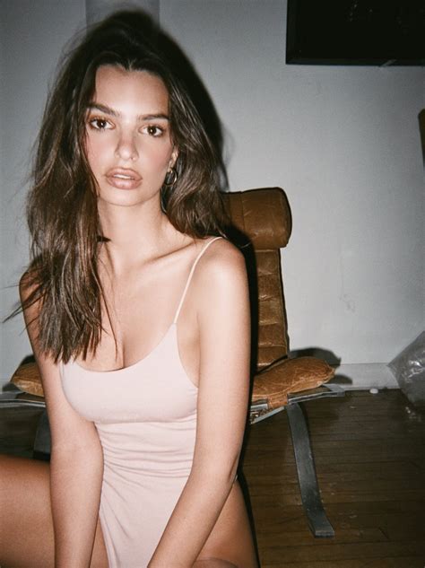 emily ratajkowski shows her ass and breasts while posing