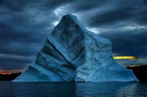 iceberg hitting bottom newfoundland  labrador cool  newfoundland