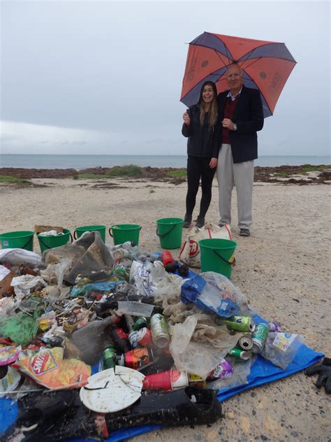 keep australia beautiful wa and coastal clean up crew remove litter from hillarys beach for