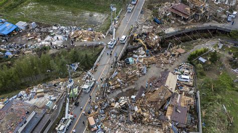 typhoon hagibis rescuers dig  missing  mudslides   killed