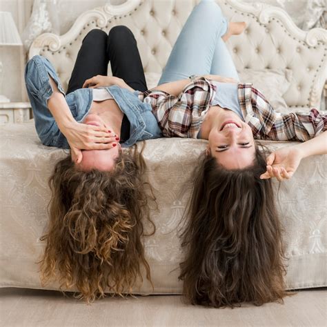 Free Photo Friends Posing On The Bed