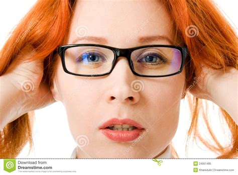 a beautiful girl with red hair wearing glasses stock image