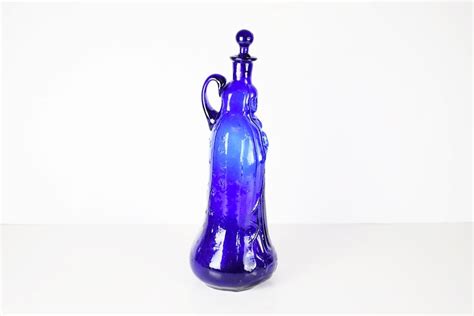 A Vintage Moldblown Cobalt Blue Glass Guadalupe Holy Water Bottle Ebth