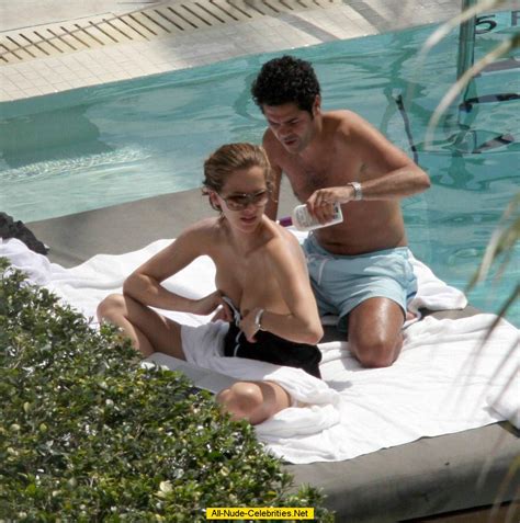french journalist and tv presenter melissa theuriau topless on a beach and poolside paparazzi shots