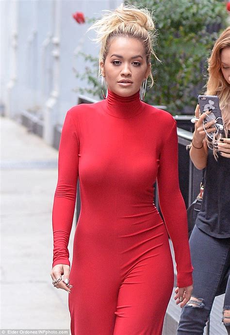 rita ora stuns in bold red jumpsuit as she talks body image daily