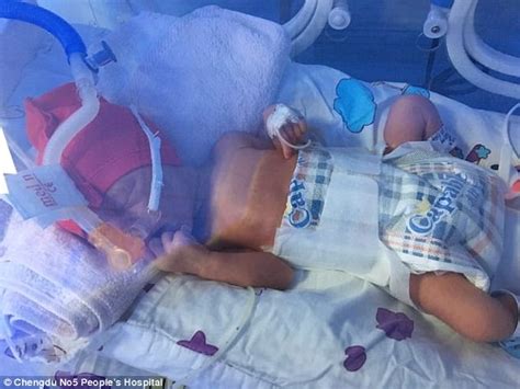 chinese couple welcome identical triplets to the world daily mail online