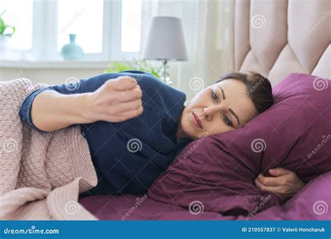 Daytime Sleep Concept Mature Woman Lying At Home On Bed With Pillow