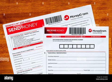 moneygram money transfer send money  receive money forms stock photo alamy
