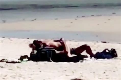 couple filmed having sex in front of sunbathers on australian beach