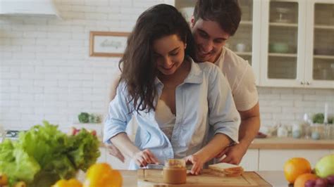 closeup happy couple cooking together at home sexy couple