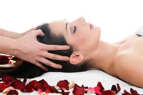 woman getting a head massage in a spa visona beauty