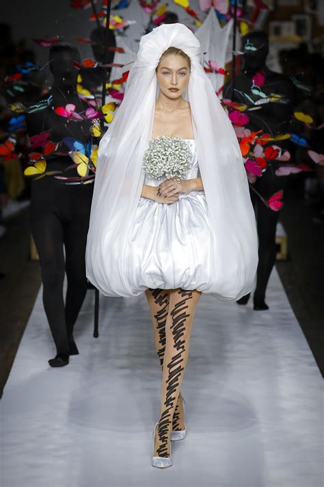 gigi hadid closed moschino runway show in a bridal dress