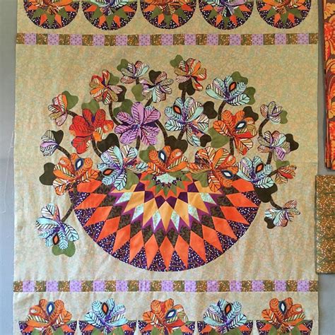 quilts  hanging   wall    decorated  flowers