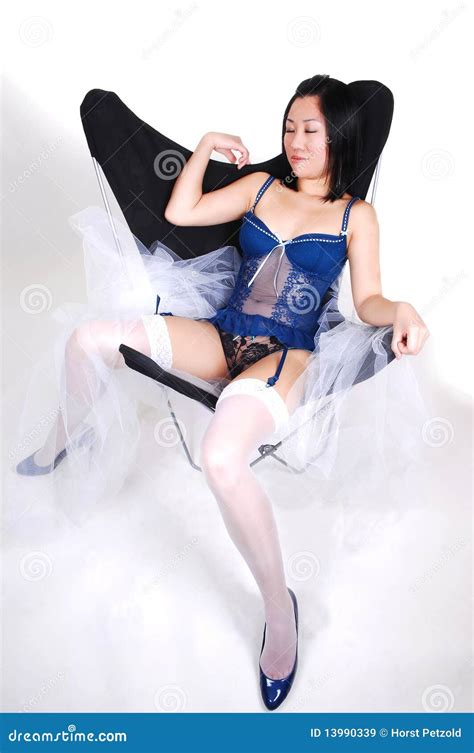 Pretty Asian Girl Sitting In Lingerie Royalty Free Stock Images