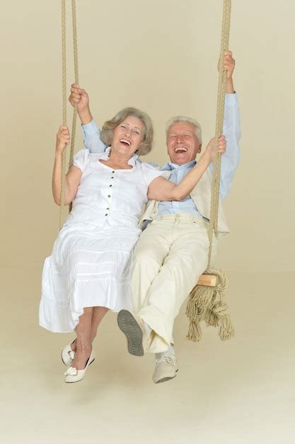 Premium Photo Portrait Of Beautiful Elderly Couple On Swing