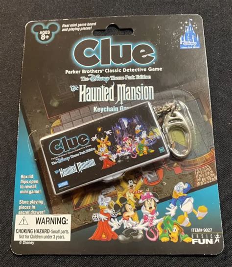 disney theme park haunted mansion keychain clue game lid flips open