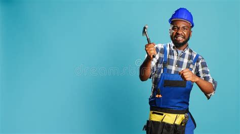 construction worker hitting   hammer stock image image  manual repairman