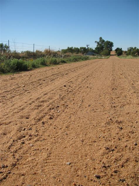 bringing   harvest  dirt road