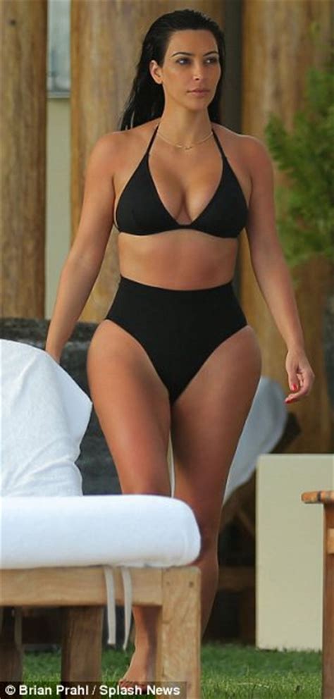 Kim Kardashian Cools Off In See Through Bathing Suit In Photos From