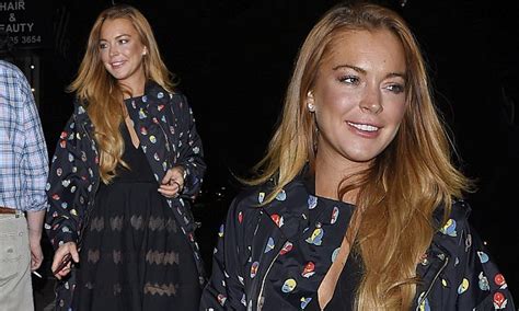 Lindsay Lohan Flashes Her Legs In A Sheer Panelled Skirt