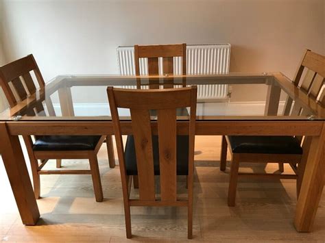 glass rectangular dining table  dining chairs  tewkesbury