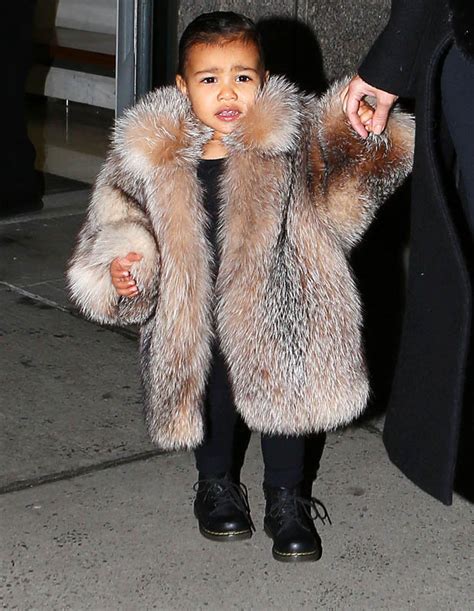 kim kardashian dresses daughter north west in massive fur coat daily star