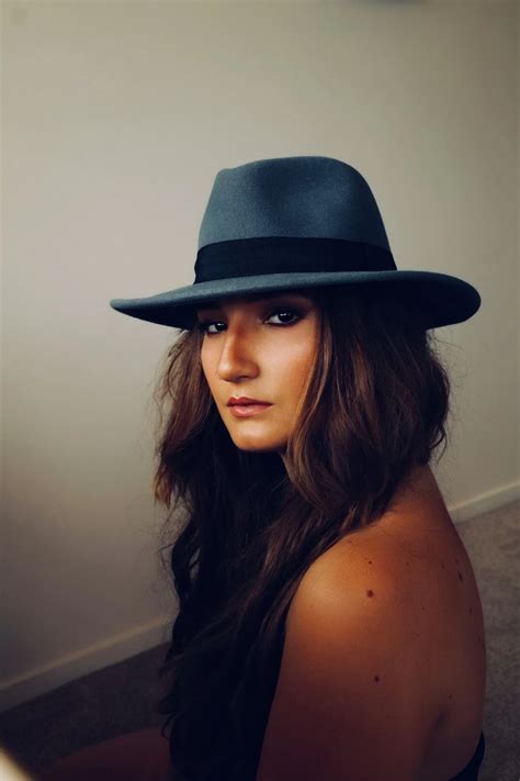 woman wearing grey hat photo free hat image on unsplash