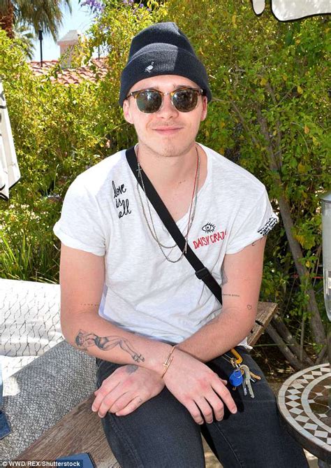 brooklyn beckham shows off dancing lady tattoo and preppy style as he