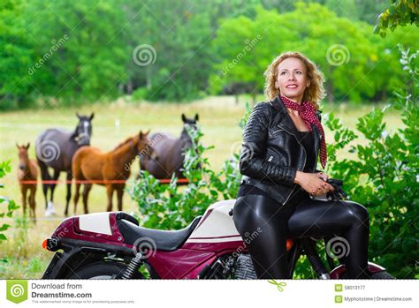 Biker Girl In Leather Jacket On A Motorcycle Over Stock