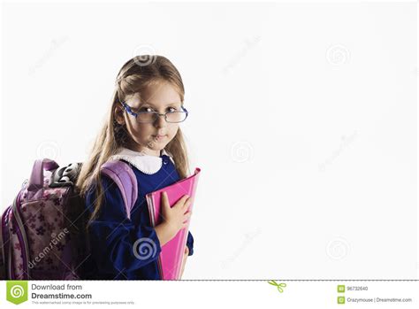 elementary age schoolgirl in uniform with backpack royalty