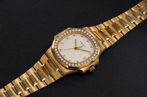 patek philippe ref   gold nautilus wristwatch  diamond set bezel case number