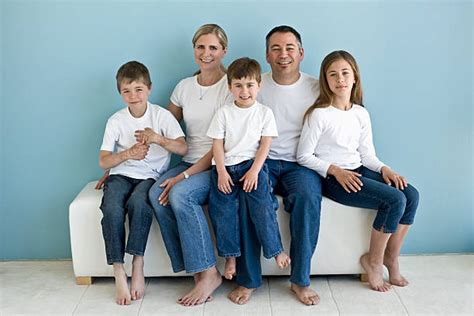 family  group  people  white shirts  jeans stock  pictures royalty
