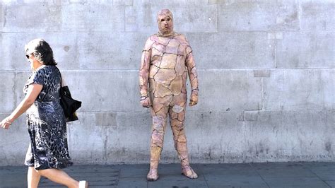 Artist In Chicken Skin Gimp Suit Walks Around London