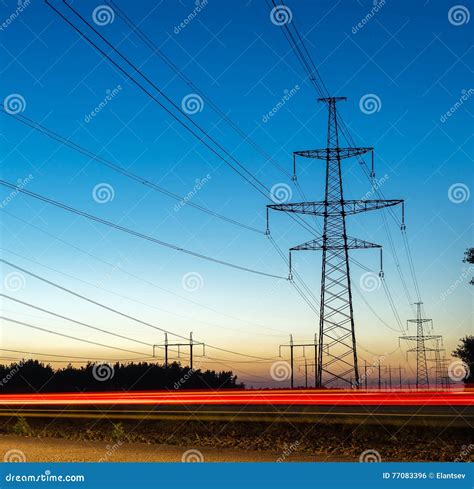 pylons  electricity power lines  night  traffic lights stock photo image