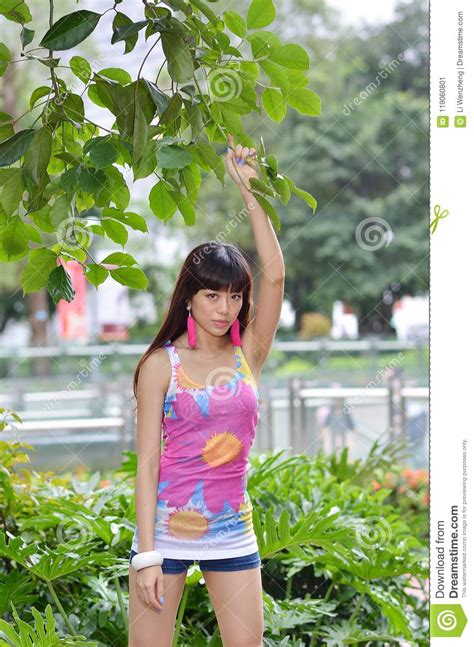 Beautiful Asian Girl Shows Her Youth In The Park Stock