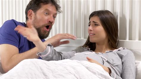 Dolly Shot Of Pregnant Woman With Contractions In Bed