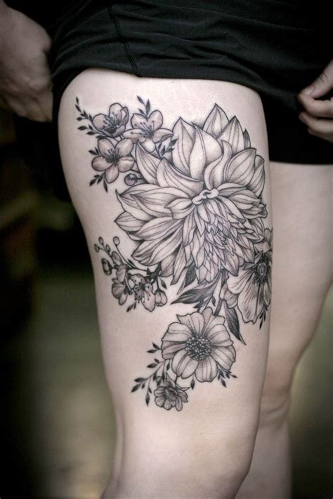 black lines dahlias and garden flowers tattoo on hip by alice kendall