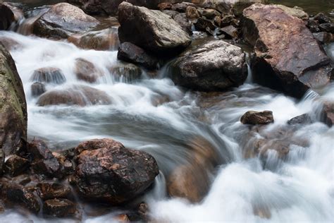 water flowing  rocks  sec exposure   park  gu flickr