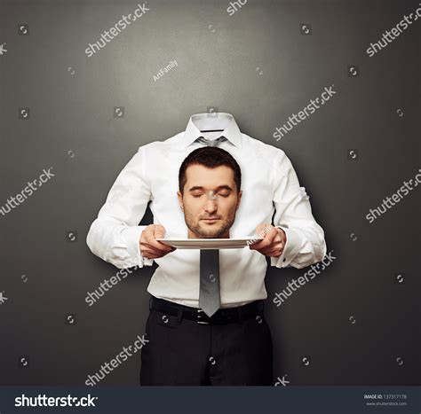 headless man holding  head  stock photo  shutterstock