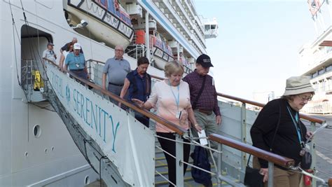 cruise ship   northwest passage brings tourists  tiny inuit