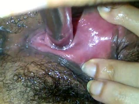 close up female urethral sounding with large rod fetish