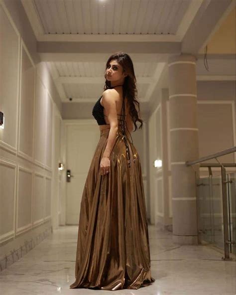Mouni Roy S Sexy Twirl In A Golden Metallic Skirt And Black Backless