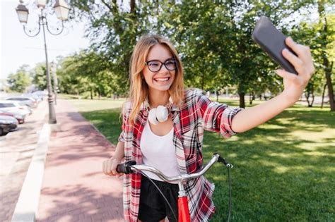 Free Photo Enthusiastic Funny Girl Making Selfie In Park Wonderful