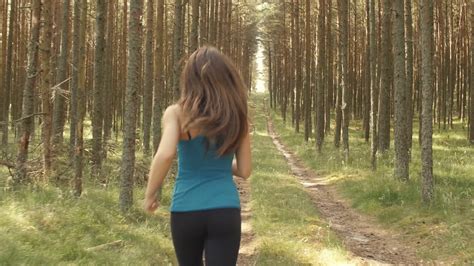 girl running through the woods stock video footage 00 31 sbv 309250730