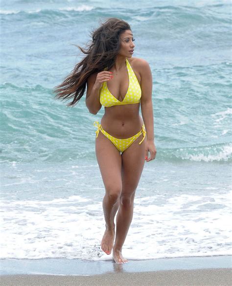 kayleigh morris in a yellow bikini on the beach while on