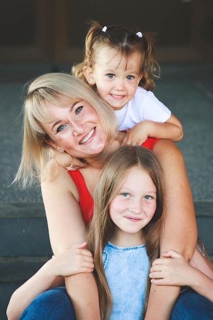 Premium Photo Beautiful Blonde Mom With Daughters Group Portrait